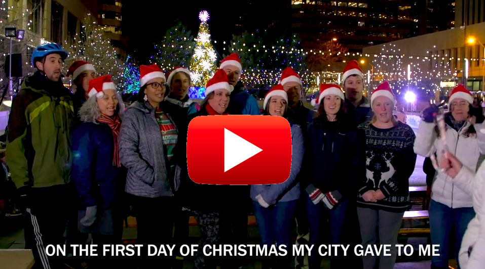 Denver Streets Partnership members singing at the Skyline Park ice rink