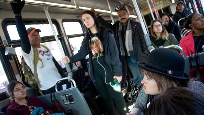 District 9 candidate Jonathan Woodley (left to right) and mayoral candidates Pendfield Tate and Kayln Rose Heffernan ride an eastbound #3 bus. Denver Streets Partnership's Amazing Denver Mobility Race, April 4, 2019. (Kevin J. Beaty/Denverite)