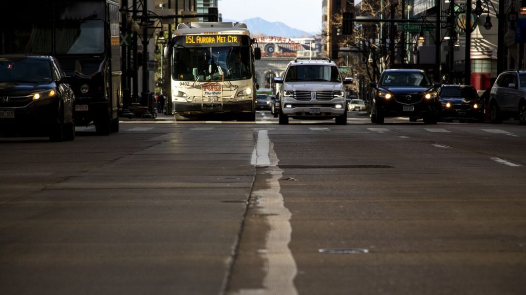 An RTD bus drives down a freshly-painted bus lane on 17th Street downtown. Dec. 13, 2019. (Kevin J. Beaty/Denverite)