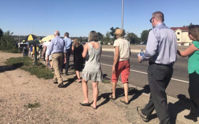 Local decision-makers take a walk with community members along Federal Boulevard in northwest Denver