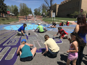 People painting a mural